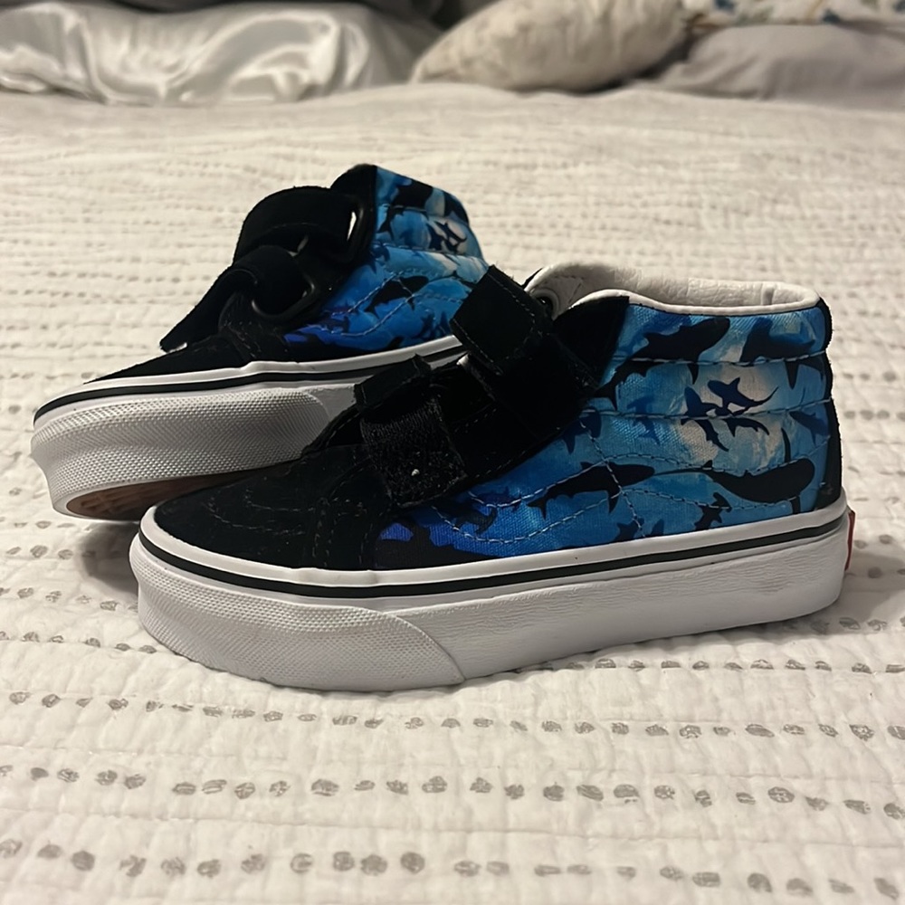 Brand new. 11 Toddler Shark Vans.